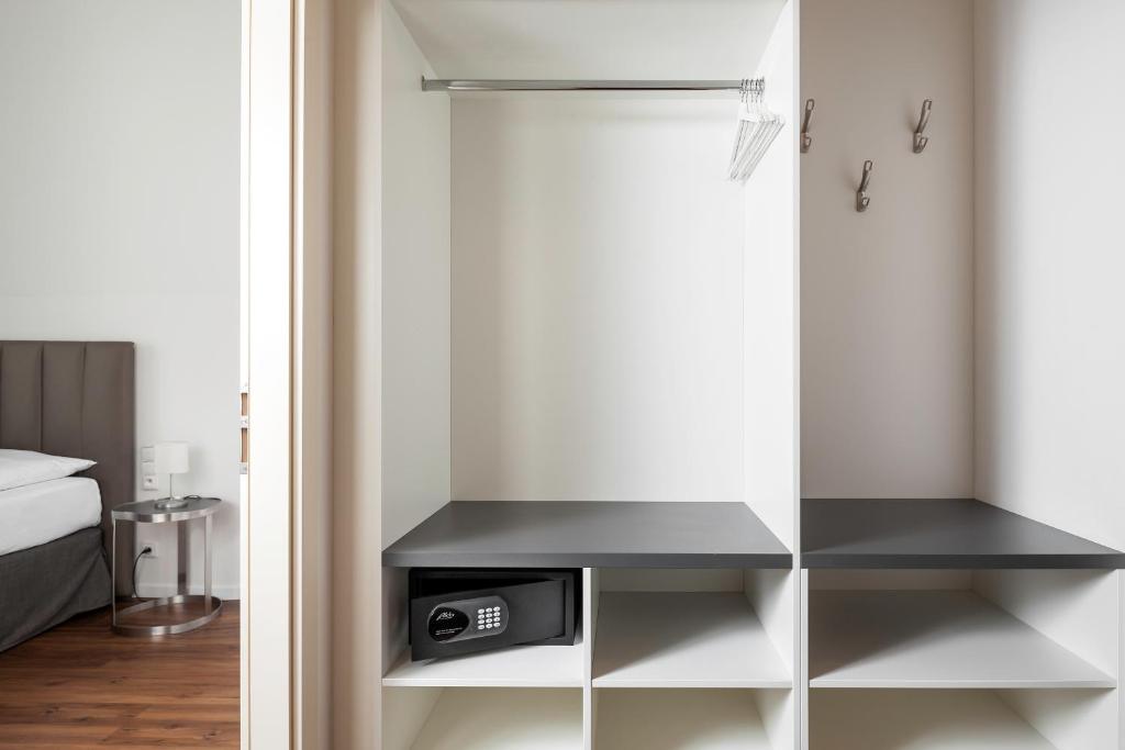 Postel nebo postele na pokoji v ubytování Elizabeth Suites