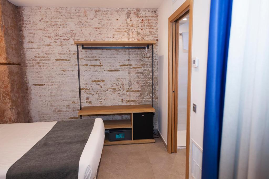 Postel nebo postele na pokoji v ubytování Hostal Paris