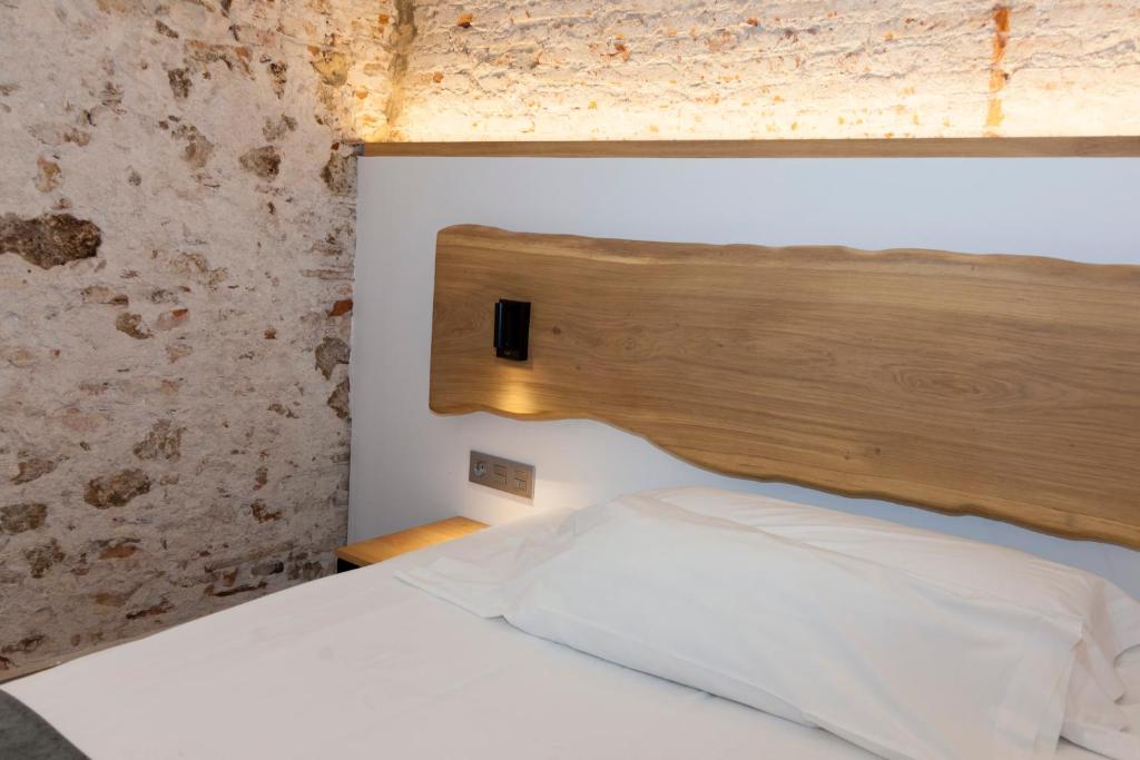 Postel nebo postele na pokoji v ubytování Hostal Paris