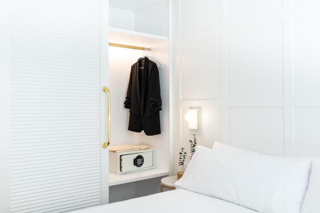 Postel nebo postele na pokoji v ubytování Cosmo Hotel Boutique