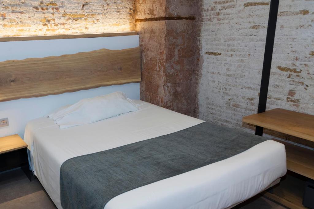 Postel nebo postele na pokoji v ubytování Hostal Paris