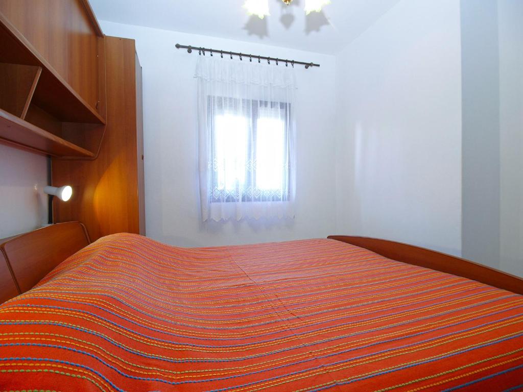 Postel nebo postele na pokoji v ubytování Apartments Miranda 1858