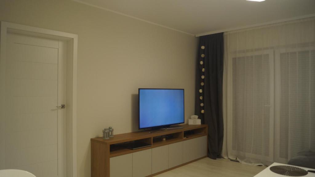 Televízia a/alebo spoločenská miestnosť v ubytovaní Studio 33 z Ogrodem