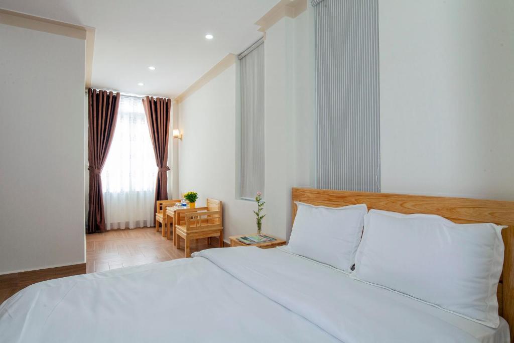 Postel nebo postele na pokoji v ubytování THIEN AN GUEST HOUSE
