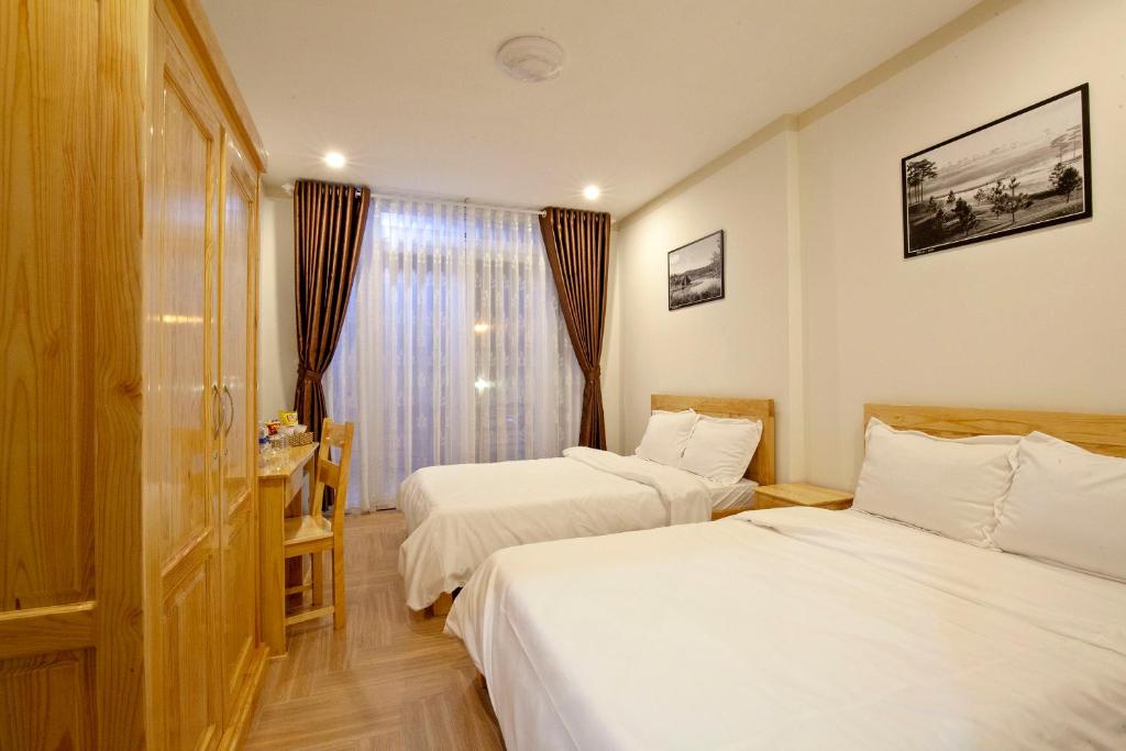 Postel nebo postele na pokoji v ubytování THIEN AN GUEST HOUSE