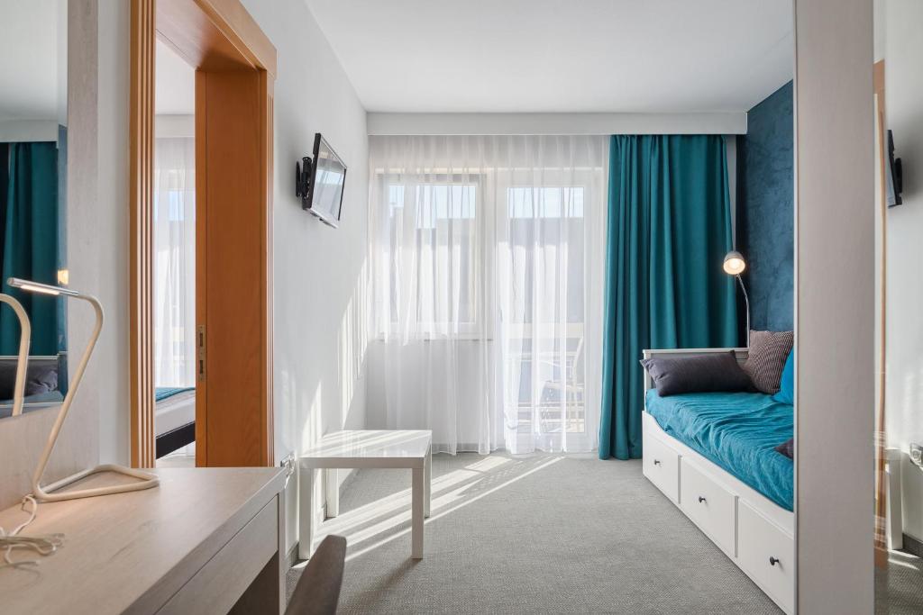 Postel nebo postele na pokoji v ubytování Hotel Porec