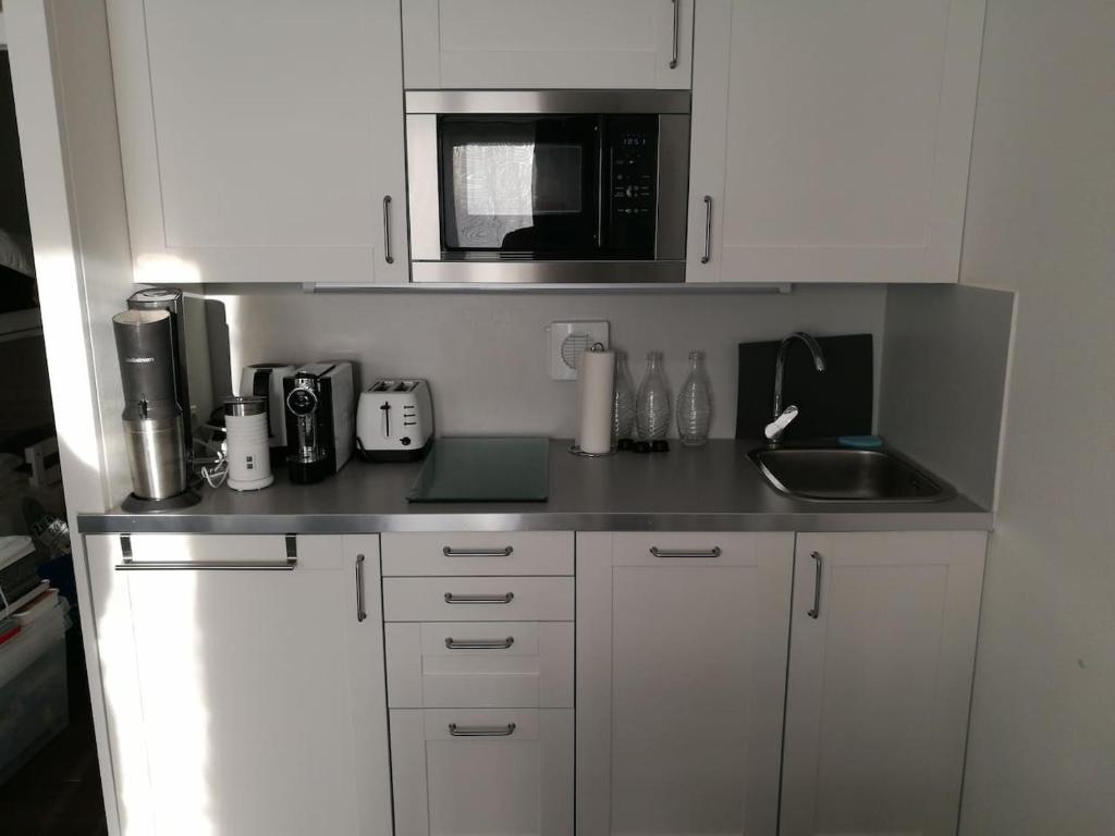 Kuchyň nebo kuchyňský kout v ubytování Top Appartment mit Weitblick und Late Check-Out inklusive aktivCARD
