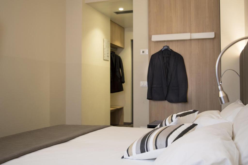 Postel nebo postele na pokoji v ubytování Hotel Alexander
