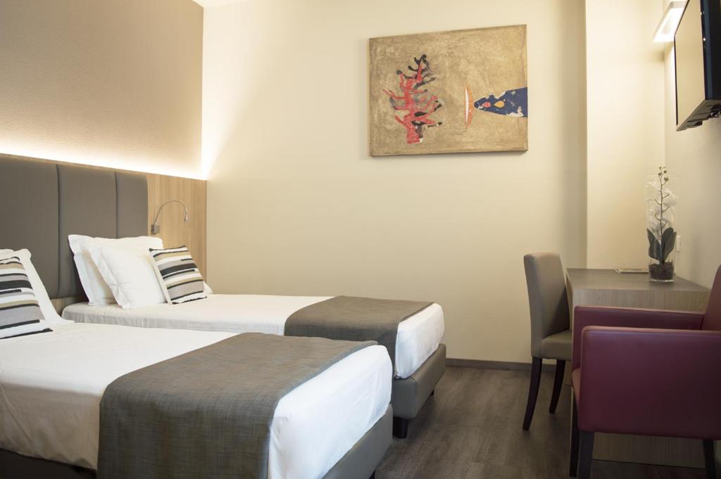 Postel nebo postele na pokoji v ubytování Hotel Alexander