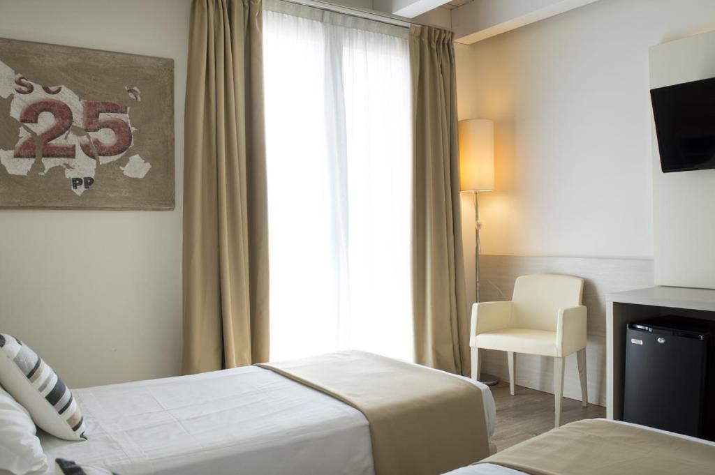 Postel nebo postele na pokoji v ubytování Hotel Alexander