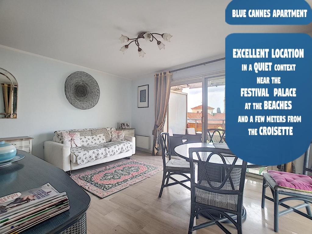 a living room with a table and chairs at BLUE CANNES Apartment in Cannes