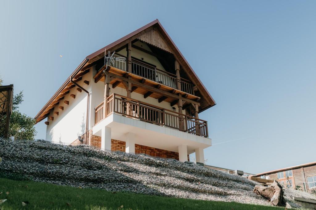 a house on top of a hill at Hej na Mazury Apartamenty in Ruciane-Nida