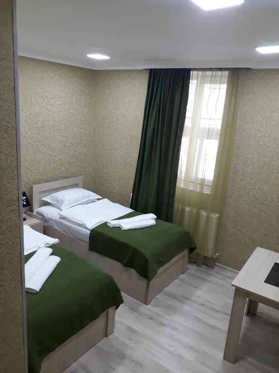 Postel nebo postele na pokoji v ubytování Vardzia in 15