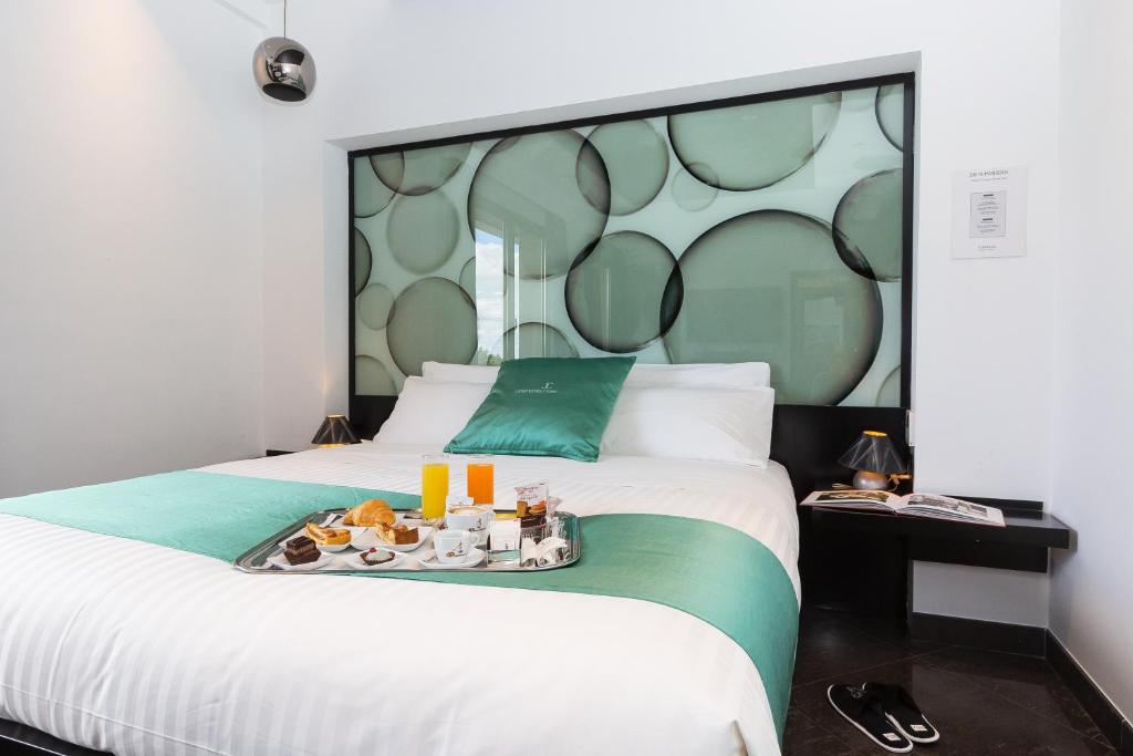 Postel nebo postele na pokoji v ubytování JC Hotel