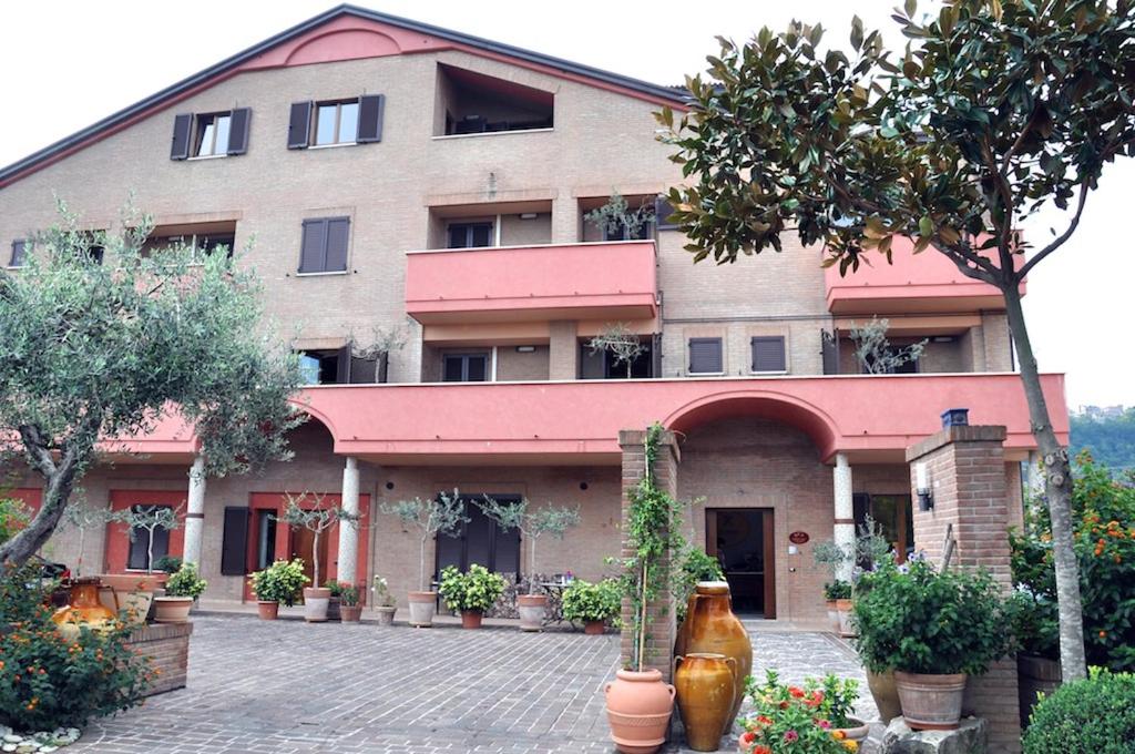 a large building with plants in front of it at Residence Criro in Marina Palmense
