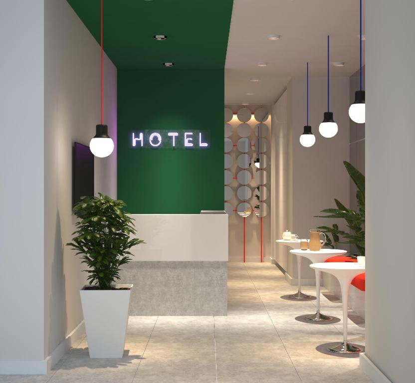 a hotel with a potted plant in a hallway at Vere Side Hotel in Tbilisi City