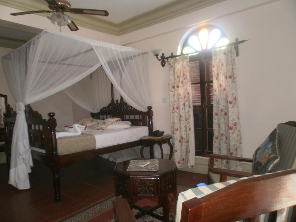Postel nebo postele na pokoji v ubytování Asmini Palace Hotel