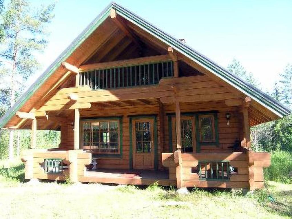 a small log cabin with a large roof at Holiday Home Suvikumpu by Interhome in Tuusmäki