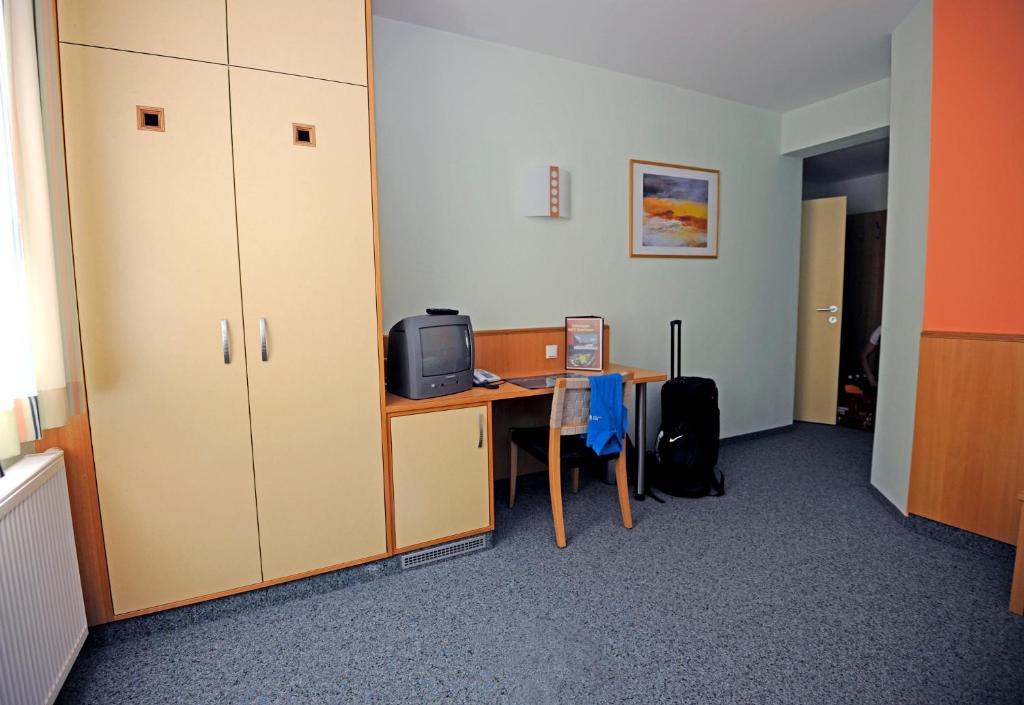 TV a/nebo společenská místnost v ubytování Austrian Sports Resort, BSFZ Obertraun