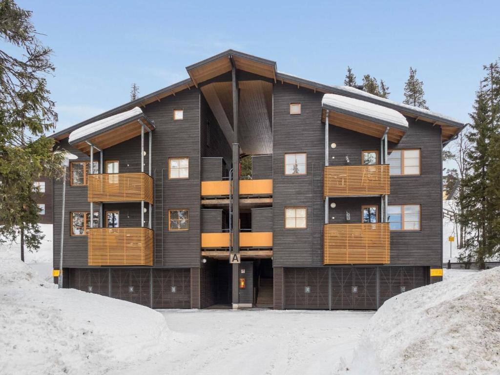 a building with balconies on the side of it at Holiday Home Karhunvartijan linna a7 by Interhome in Ruka