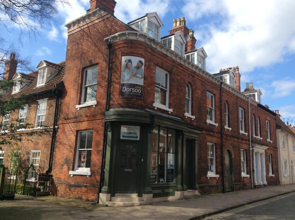 a red brick building with a sign on it at Highgate, Beverley/Hull in Beverley