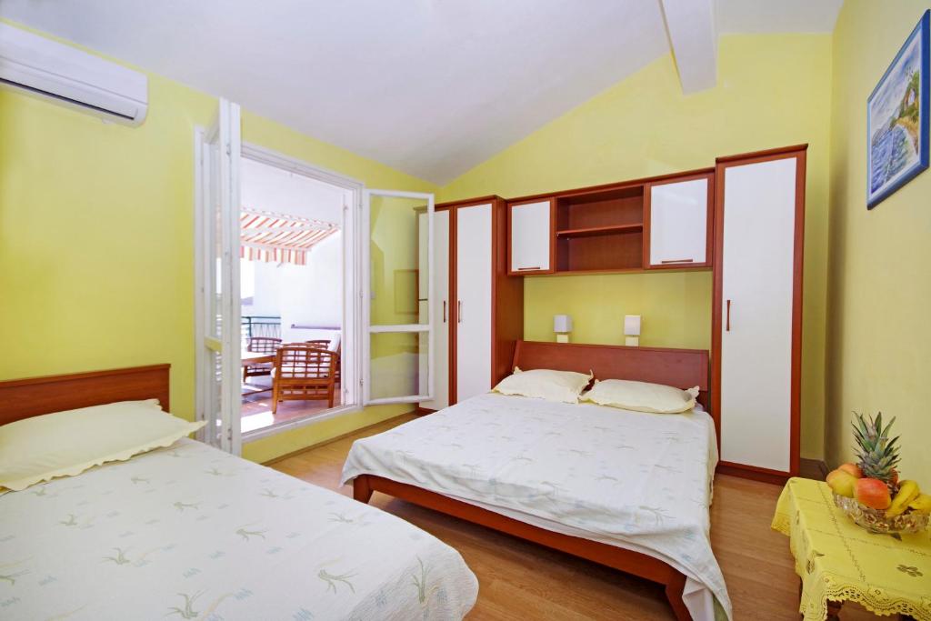 Posteľ alebo postele v izbe v ubytovaní Apartments Ribarević