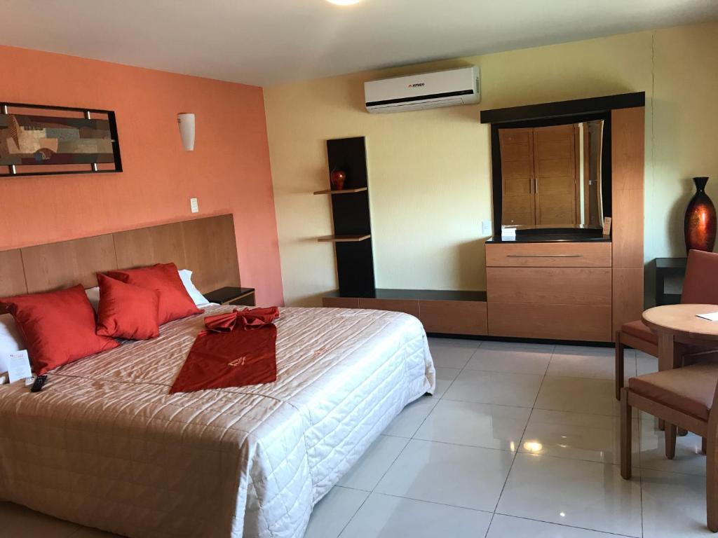 Postel nebo postele na pokoji v ubytování Hostalia Hotel Expo & Business Class