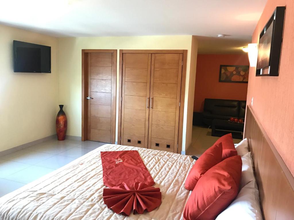 Postel nebo postele na pokoji v ubytování Hostalia Hotel Expo & Business Class