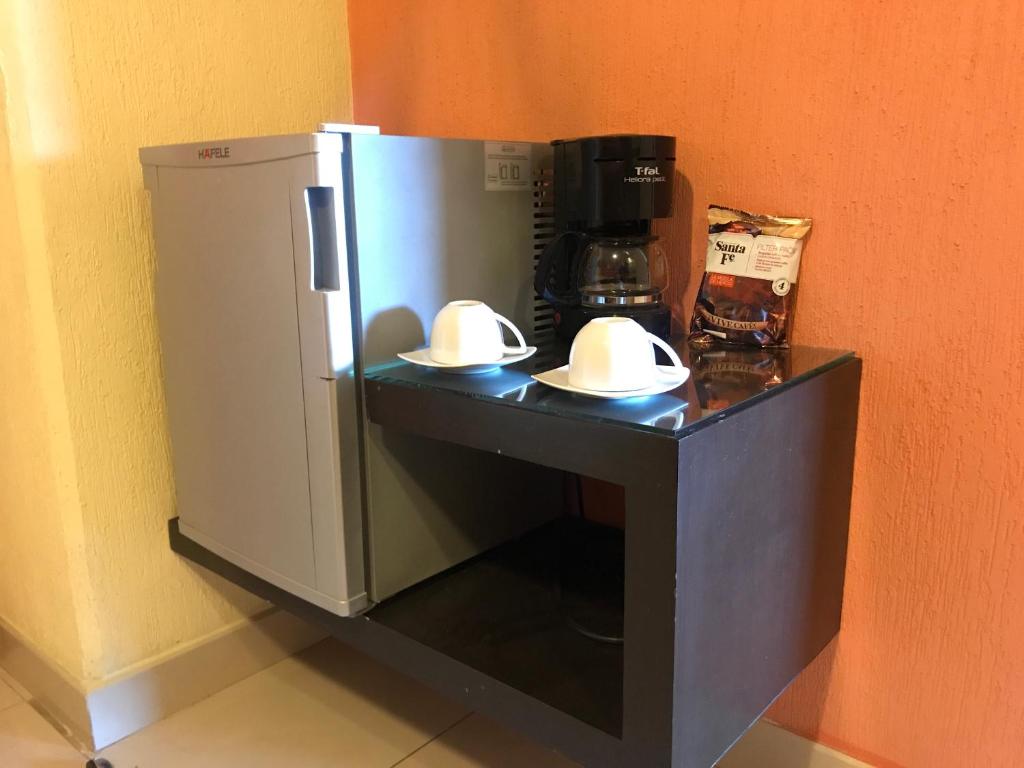 Kuchyň nebo kuchyňský kout v ubytování Hostalia Hotel Expo & Business Class