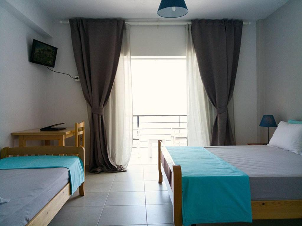 Postel nebo postele na pokoji v ubytování Sunset Boulevard Hotel