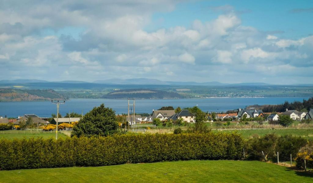 a view of a town and a body of water at Beau Rivage in Inverness