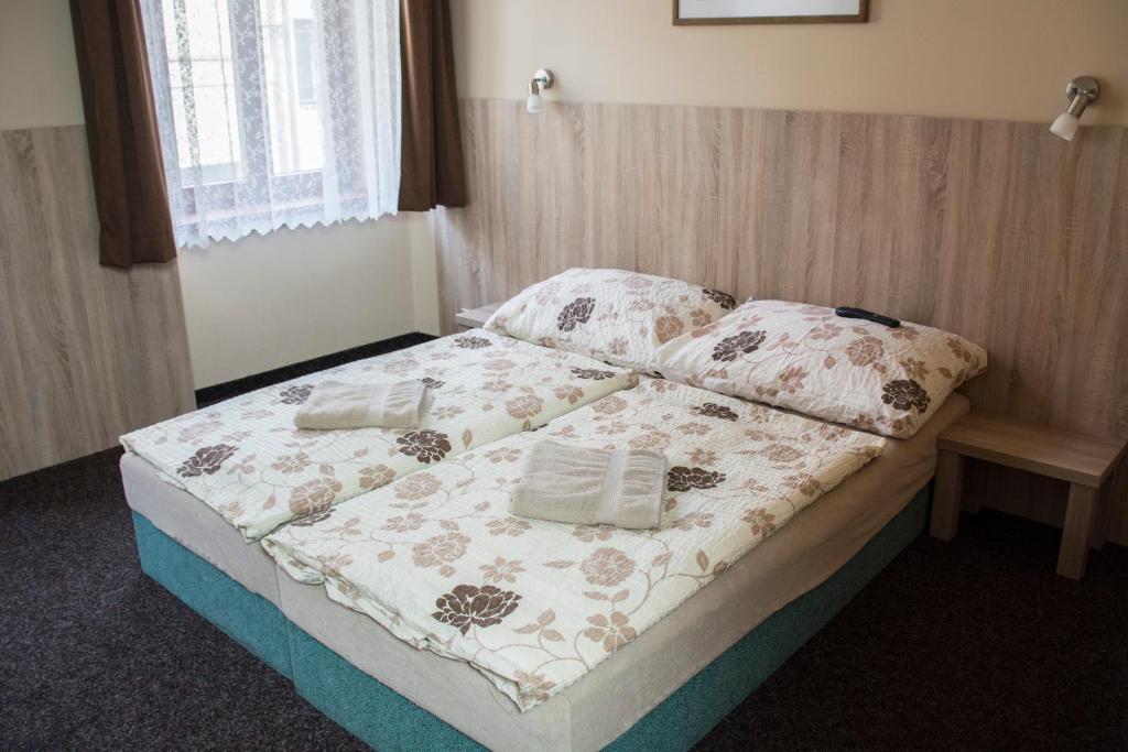 Postel nebo postele na pokoji v ubytování Penzion Krmelec