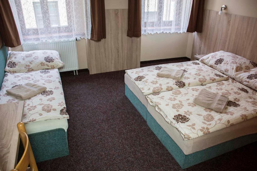 Postel nebo postele na pokoji v ubytování Penzion Krmelec