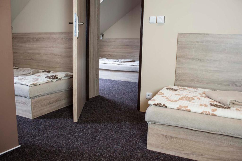 Postel nebo postele na pokoji v ubytování Penzion Krmelec