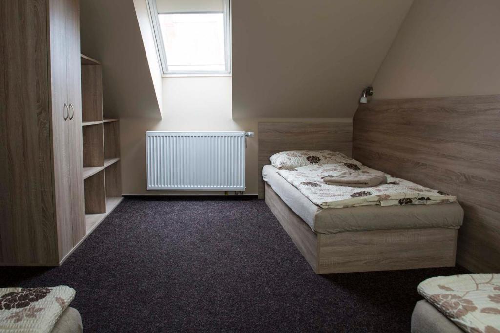 Postel nebo postele na pokoji v ubytování Penzion Krmelec