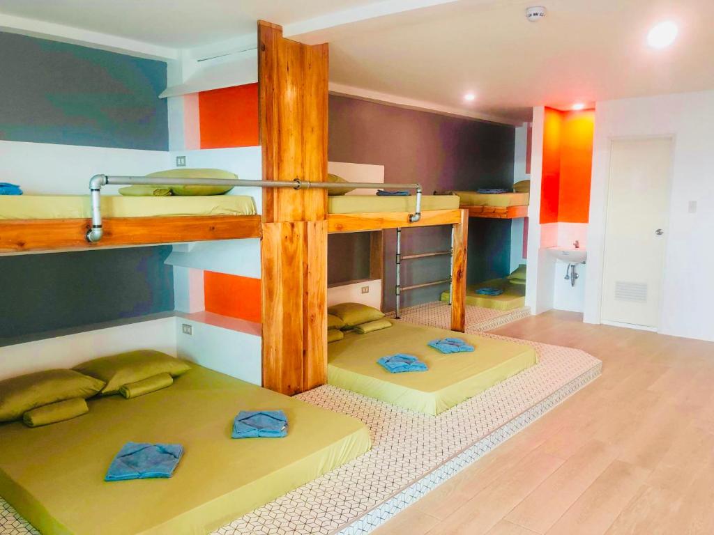 a room with two bunk beds in a room at The Escape San Juan in San Juan