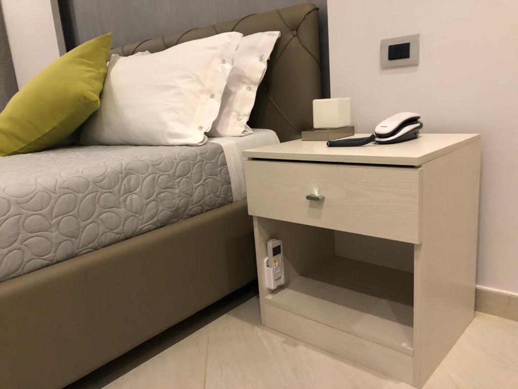 Postel nebo postele na pokoji v ubytování B&B Rossini Luxury