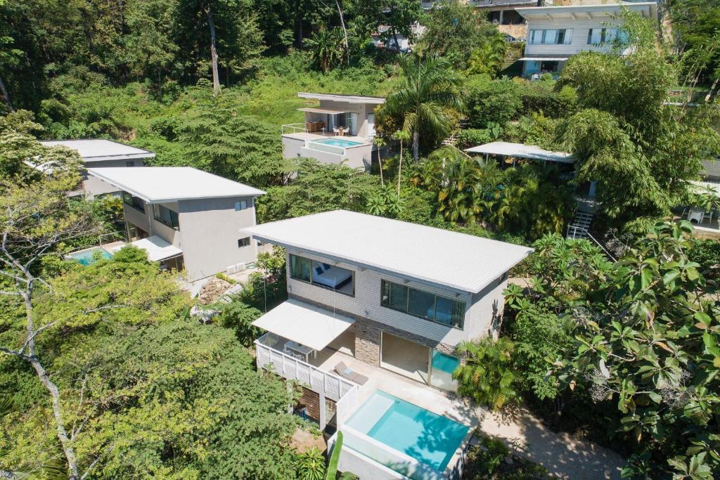 an aerial view of a house in the forest at Panavision Villas in Santa Teresa Beach