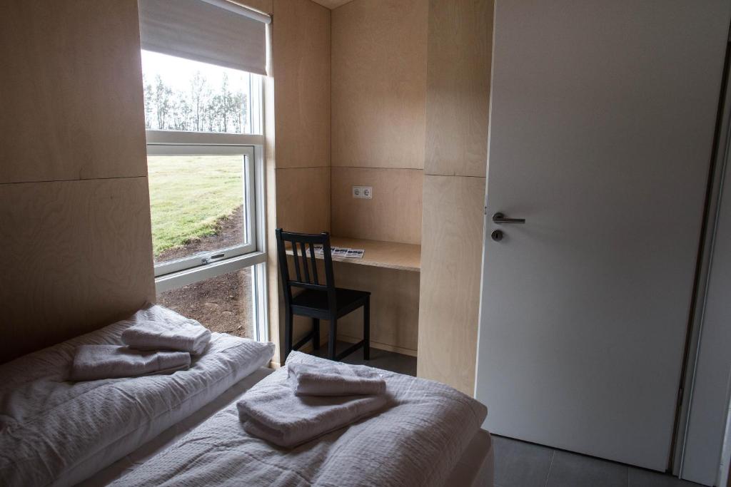 Postel nebo postele na pokoji v ubytování Einishus Cottages