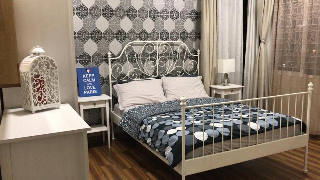 Postel nebo postele na pokoji v ubytování Bayu TAMARA RESIDENCE PUTRAJAYA