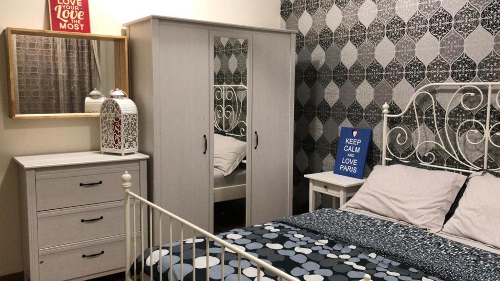 Postel nebo postele na pokoji v ubytování Bayu TAMARA RESIDENCE PUTRAJAYA