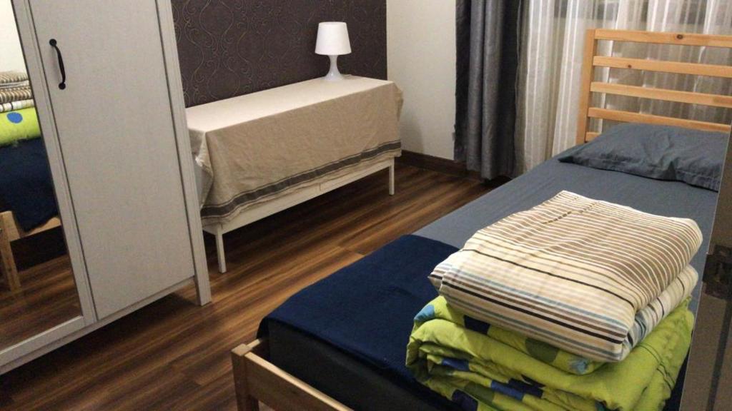 Postel nebo postele na pokoji v ubytování Bayu TAMARA RESIDENCE PUTRAJAYA