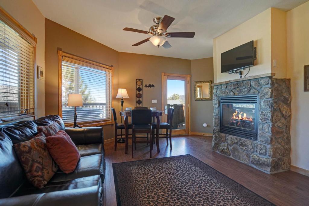 a living room with a couch and a fireplace at Mount Meeker 26B Condo in Estes Park
