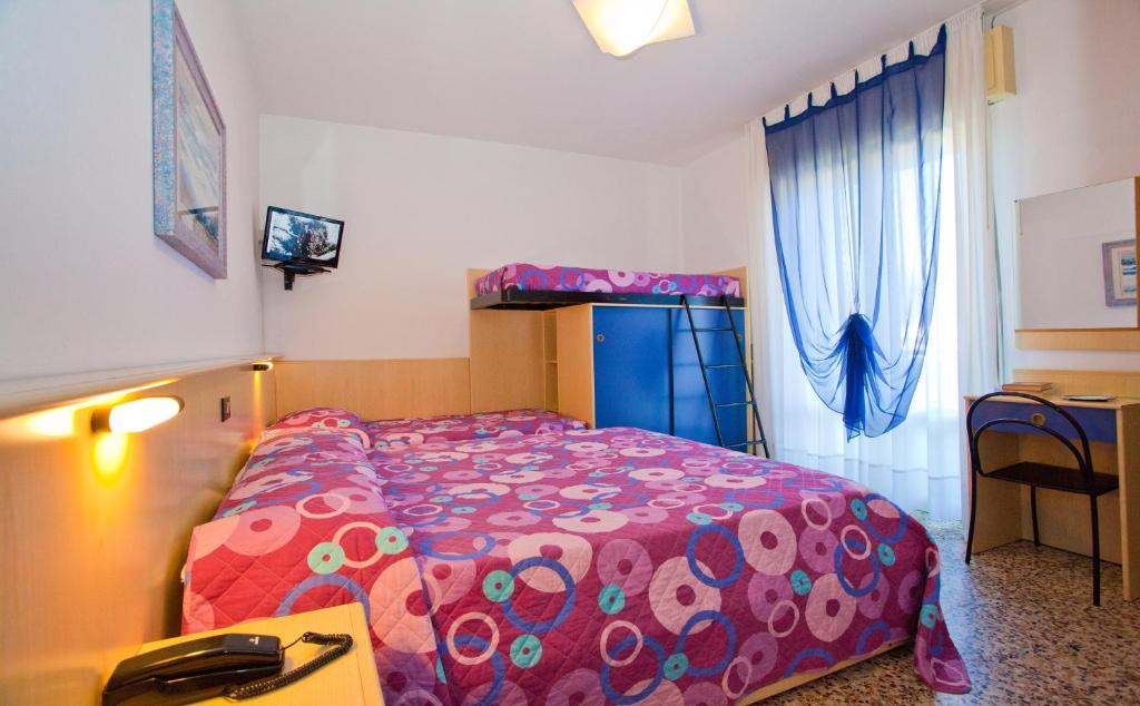 Postel nebo postele na pokoji v ubytování Hotel Catto Suisse