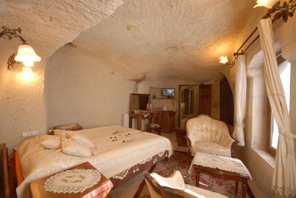 Postel nebo postele na pokoji v ubytování Arif Cave Hotel