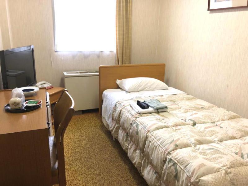 Postel nebo postele na pokoji v ubytování Hotel Oonoya
