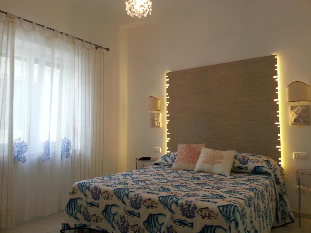 Postel nebo postele na pokoji v ubytování Fortino B&B Capri