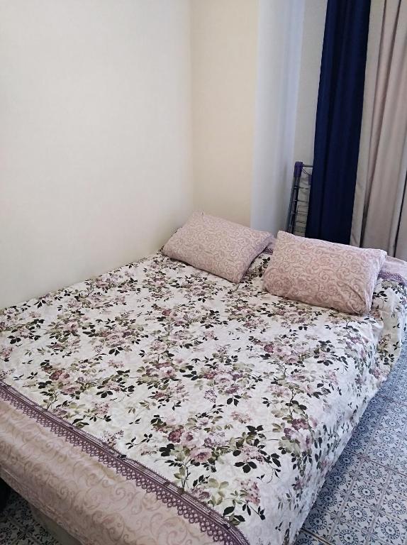 Postel nebo postele na pokoji v ubytování zhk Santorini