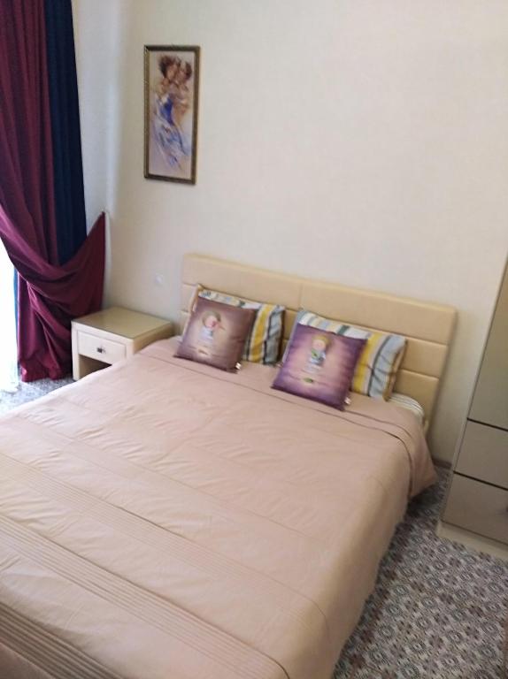 Postel nebo postele na pokoji v ubytování zhk Santorini