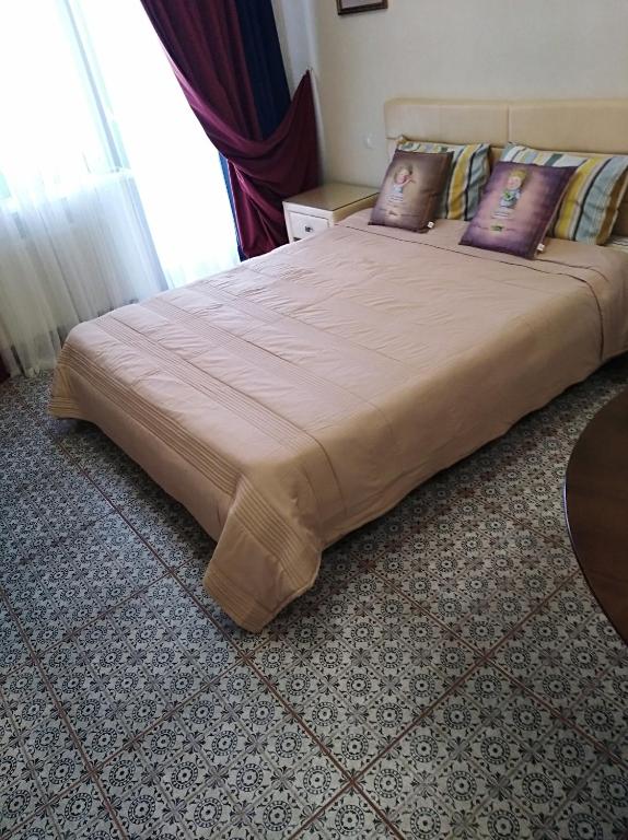 Postel nebo postele na pokoji v ubytování zhk Santorini